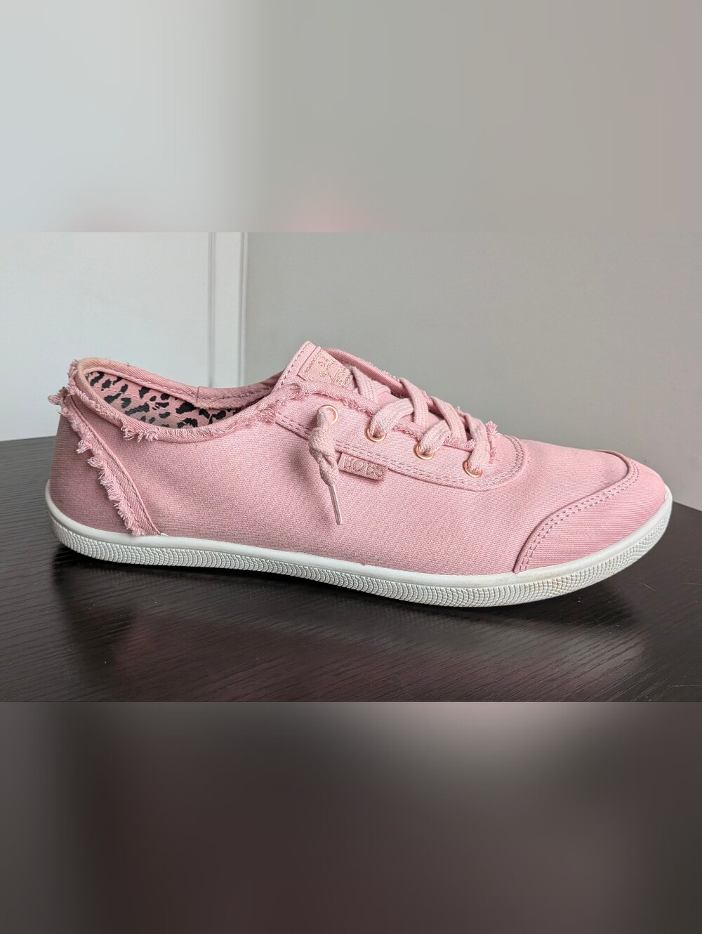 Pink BOBS from Skechers canvas slip-on sneakers with Memory Foam insoles.